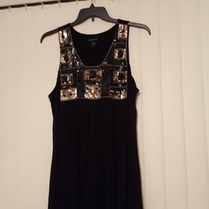 Black and gold sequined bodice little black dress